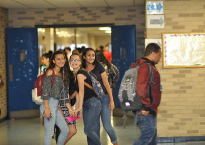 Students traveling through hallway